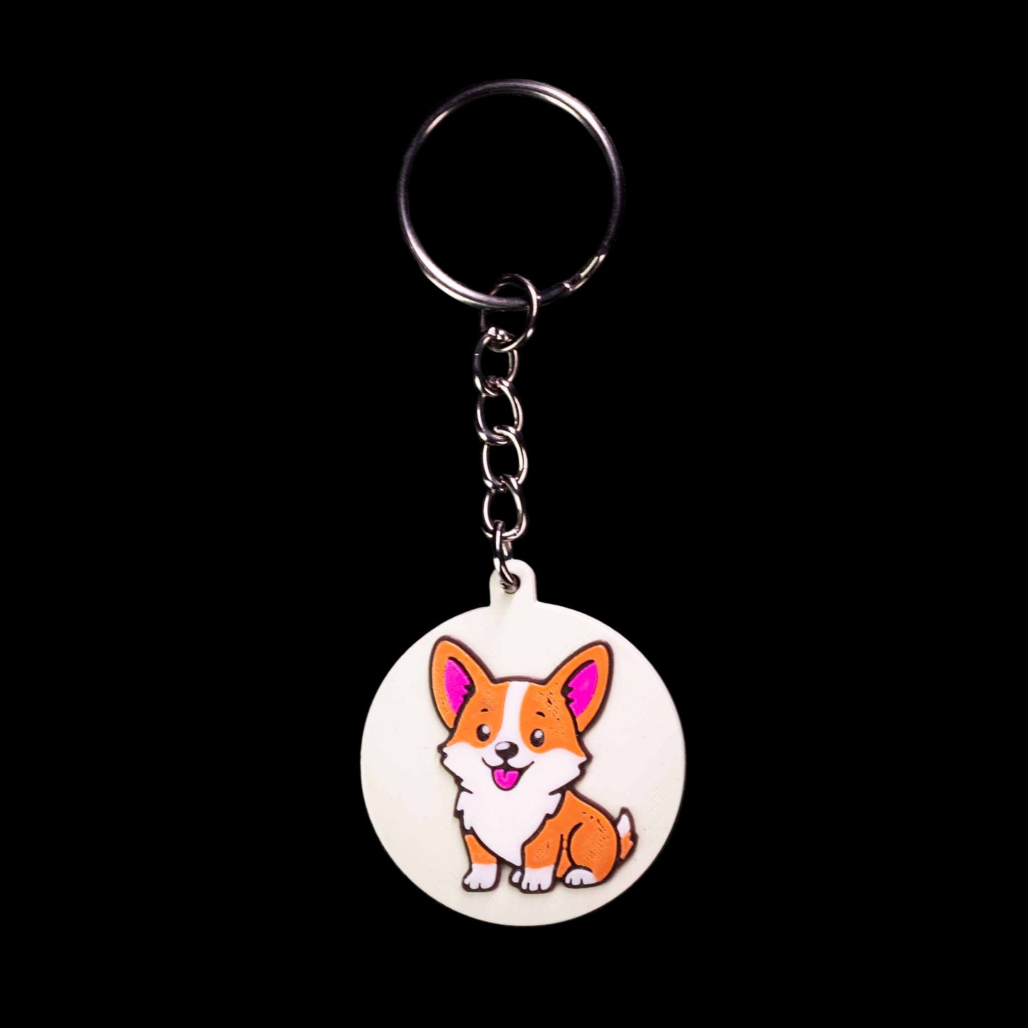 Keychain with a cartoon corgi dog design on a black background