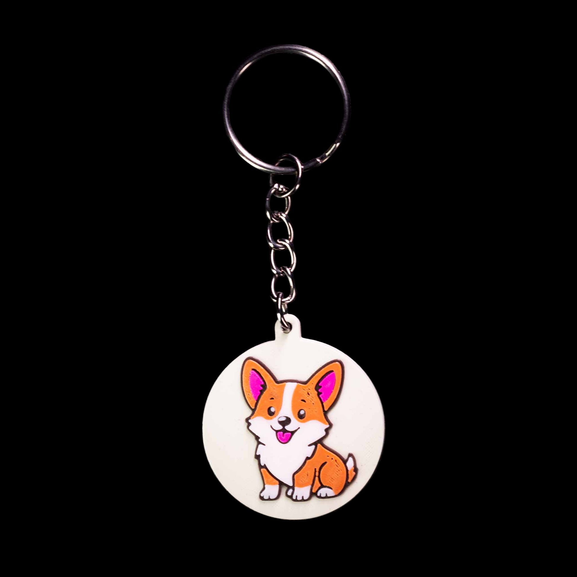 Keychain with a cartoon corgi dog design on a black background