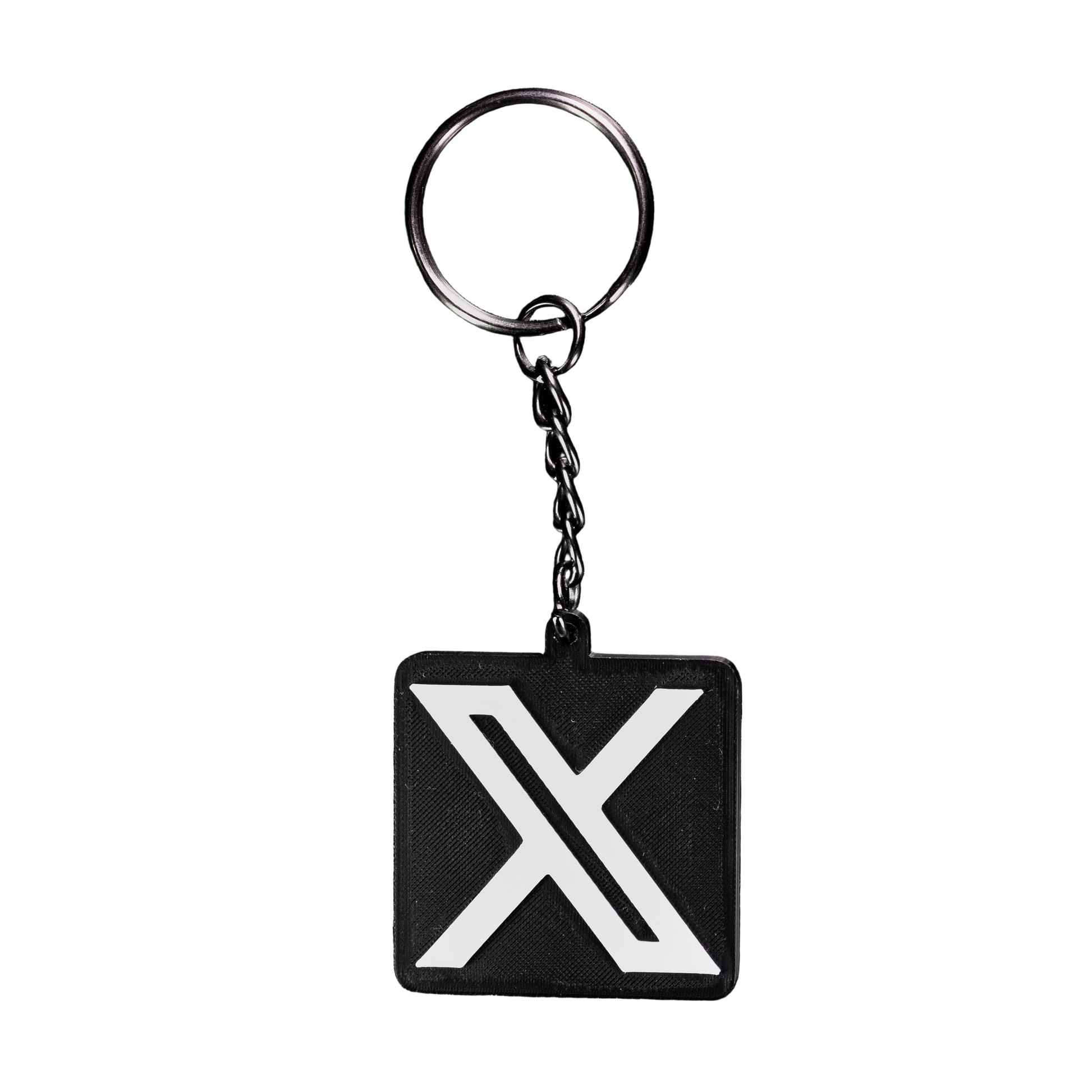 Black keychain with a white 'X' symbol on a black background