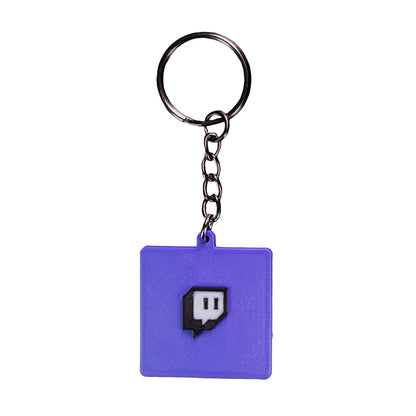 Purple keychain with a logo on a black background